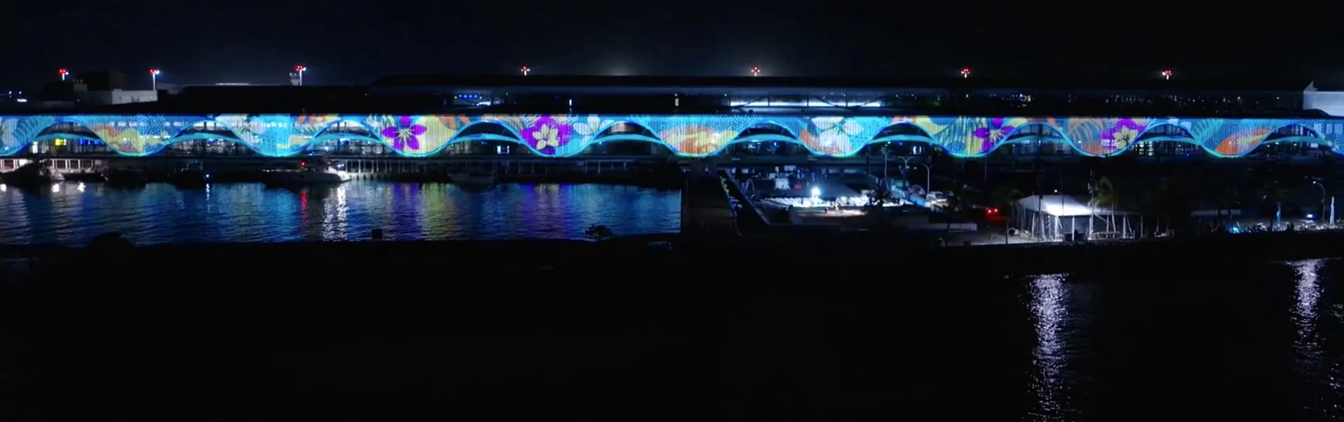 Panorama of the 362m Velana Airport facade with 3D mapping